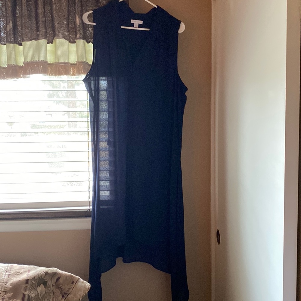 This is a long tunic sleeveless looks great with boots and leggings